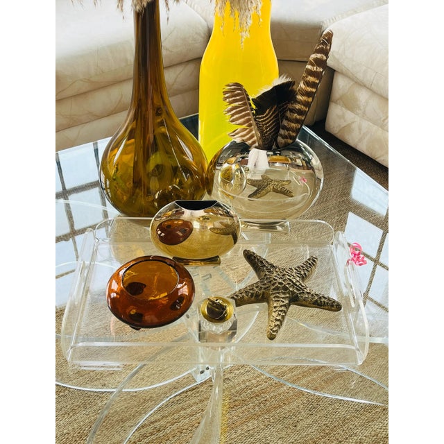 This lucite Postmodern bar tray brings a sleek, modern touch to any setting. It's minimalist appeal will blend seamlessly...