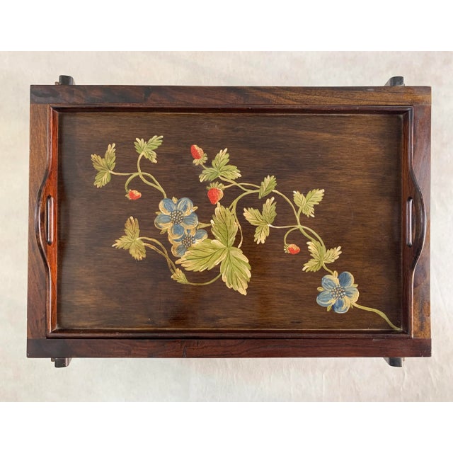 A beautifully hand painted floral tray with removable stand crafted from Guanacaste and Mahogany woods native to Central...