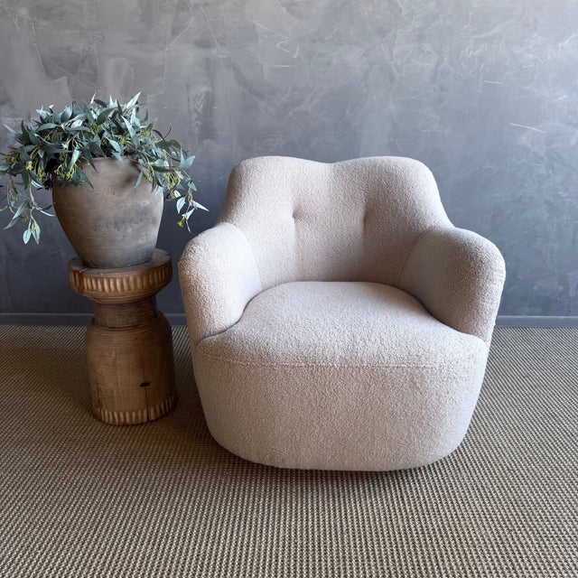 This mid-century modern swivel chair combines iconic retro styling with irresistible comfort. Wrapped in a plush teddy-...