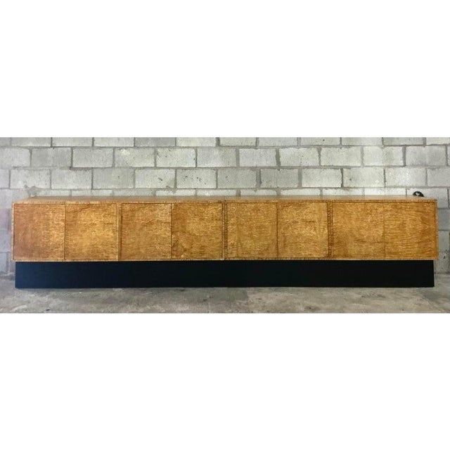 This exceptional piece is a truly monumental credenza, boasting an impressive twelve-foot length that demands attention in...