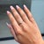 This elegant ring showcases a 0.35 carat natural oval cabochon opal, set in 14k yellow gold. The center stone measuring...
