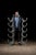 Matching pair of freestanding cast iron pipe racks, each constructed with five graduated U-shaped cradles designed to...