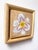 This oil on panel artwork presents a delicate depiction of a Hemerocallis flower, showcasing its intricate petals in soft...