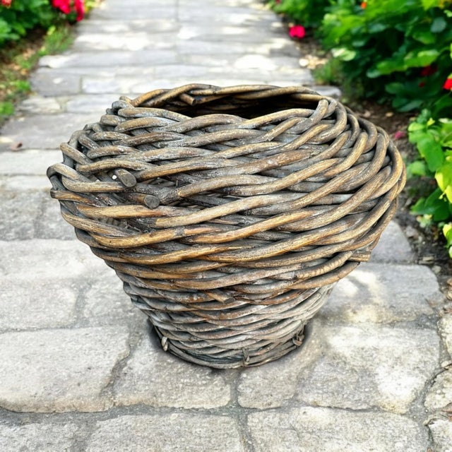 Antique primitive hand woven large basket. Bi-cone shape showcasing naturally aged-patina loaded up on timeless character....