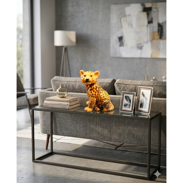 Charming Mid Century Italian leopard cub figure. This ceramic cat statue is in an upright sitting position. It is hand...