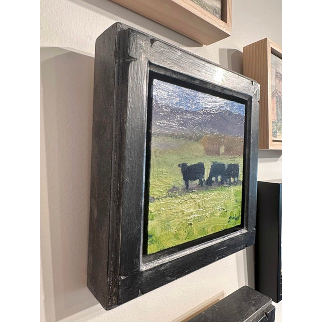 Contemporary Lunch Time by Seth Winegar | Oil on panel of cows in a grassy field with mountains in the background For Sale - Image 3 of 3