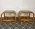 Stylish Italian pair of vintage mid-century modern bohemian bamboo-and-rattan side tables with dark, smoked glass tops....