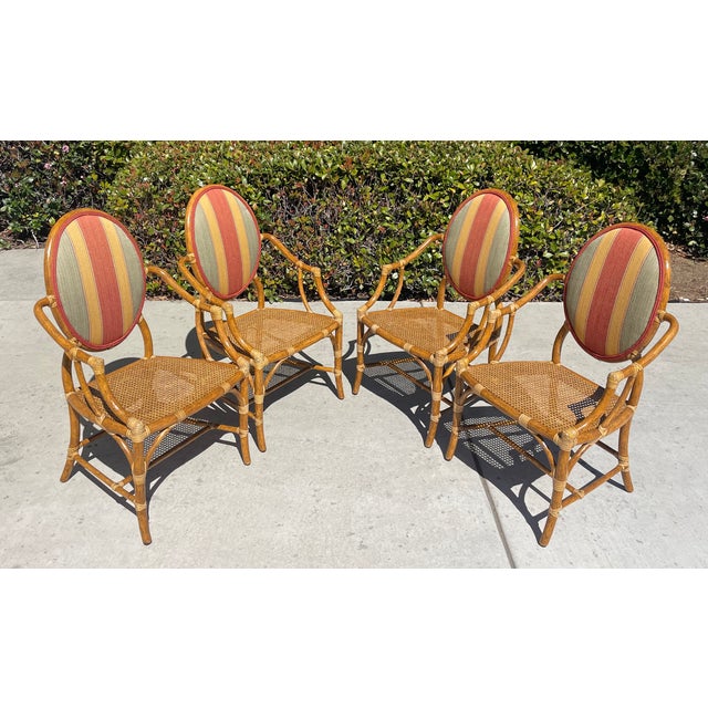 Iconic set of 4 vintage rattan armchairs by luxury brand McGuire of San Francisco. Can be used as dining/game table...