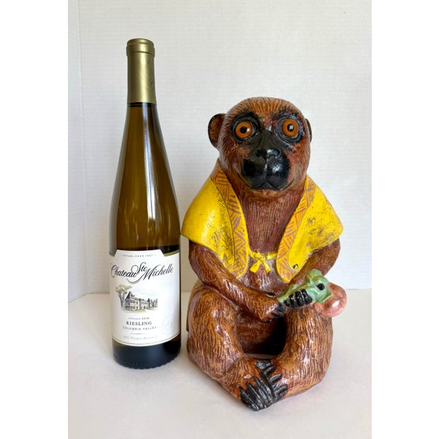 This vintage monkey figure, likely dating to the 1970s, is crafted from a lightweight molded fiber composite with a hollow...