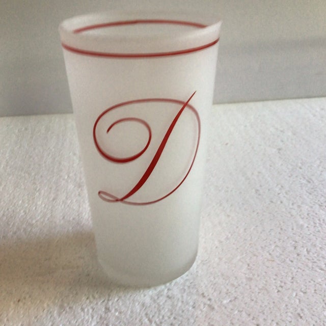 Here you will find a set of 8 frosted Federal Glass Company tumblers with a red embossed cursive “D” and red stripe around...