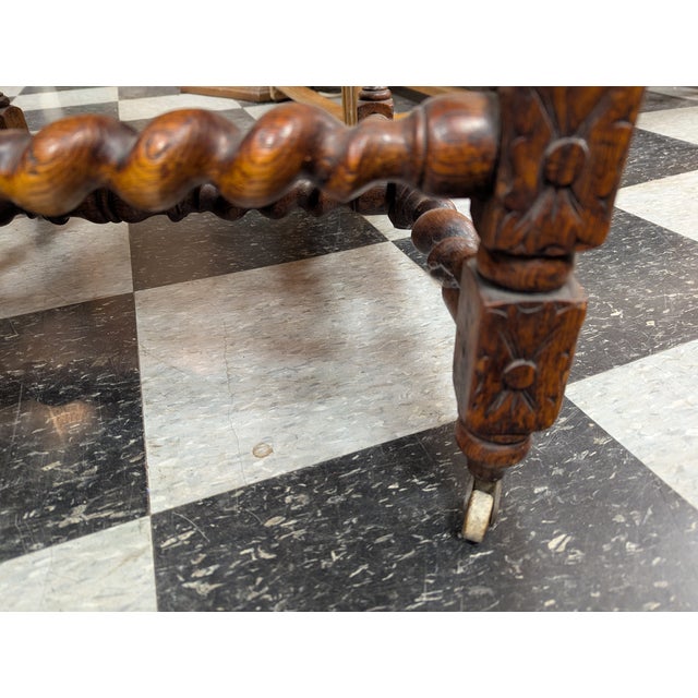 Vintage highly carved Arm Chair from the Brittany region of France. Tapestry fabric with nail head accents. See photos for...