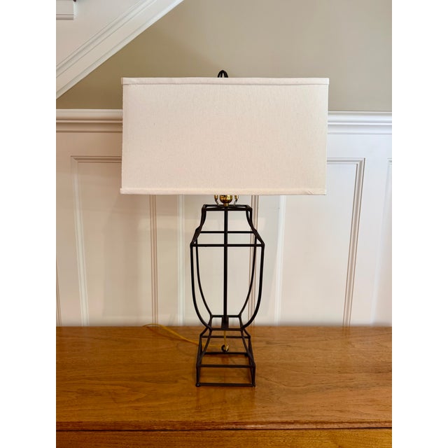Beautiful open-cage wrought iron table lamp with urn design and large rectangular linen shade. Great for a console or...