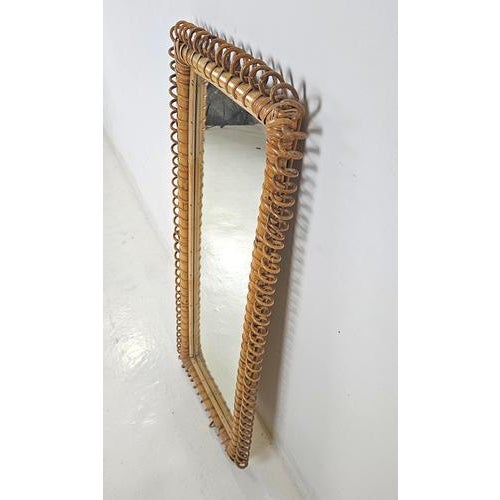 A rectangular bamboo mirror from 1950s Italy, in the manner one associates with Franco Albini. The frame is carefully...