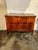The product is an antique German Biedermeier walnut commode from the 19th century. This dresser or chest of drawers exudes...