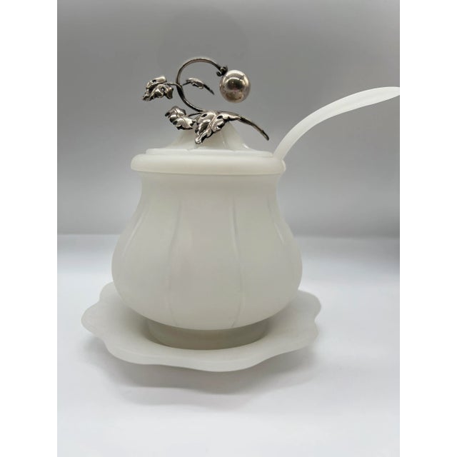 Continental, early 20th century. An antique sauce tureen made of opaline glass with a frosted finish. The bowl has a...