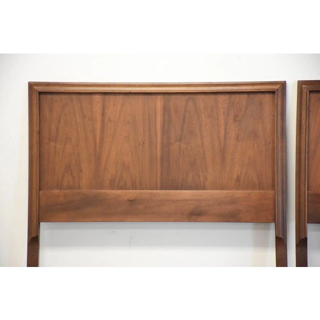 A pair of mid century modern walnut twin size headboards. 40” wide. 3” deep. 41” tall.