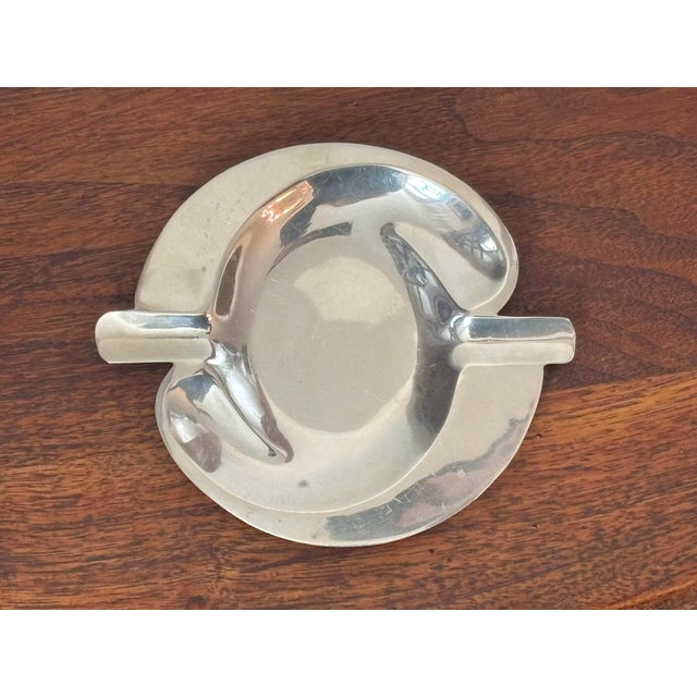 Mid-20th century sterling silver work by R. Sanchez of Mexico. This ashtray dish feels modern and timelessly chic. Marked...