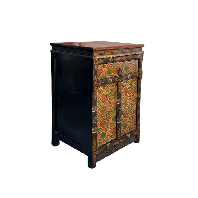 Elevate your interior space with this exquisite, hand-painted Tibetan-style cabinet, a perfect fusion of traditional...