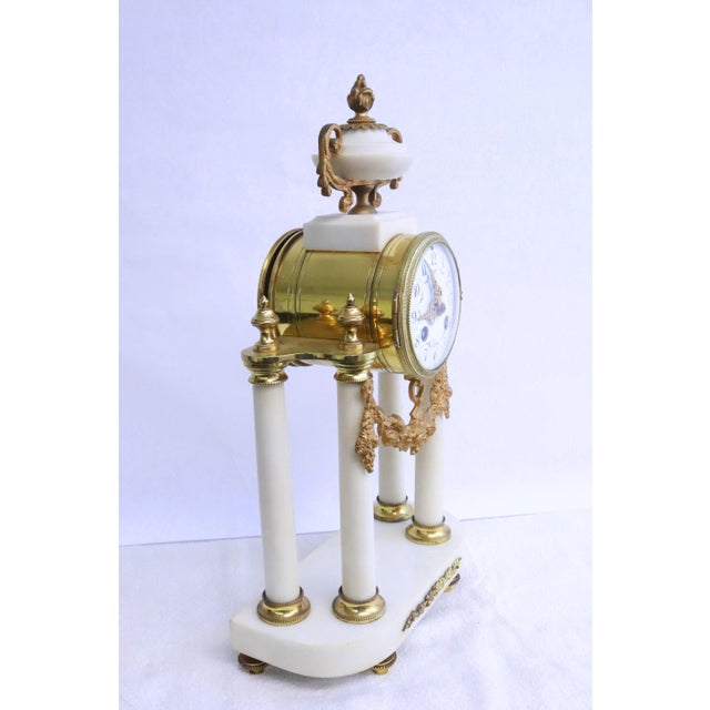 Société Clusienne Marble & Ormolu Mantel Clock, crafted in France during the late 19th century in the elegant Louis XVI...