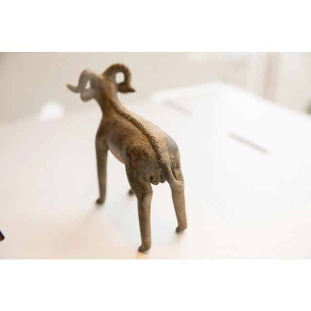 :: Vintage handmade African ram sculpture. Circa late mid 20th century, though possibly older, this piece has such...