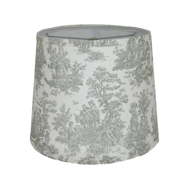 This gray toile drum shade showcases a classic pastoral design, bringing a refined and elegant touch to your home. The...