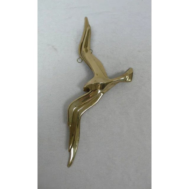 A set of 3 brass swallows, flying in three sizes as a wall decor to hang up hanging from the 50s 60s, the mid century...