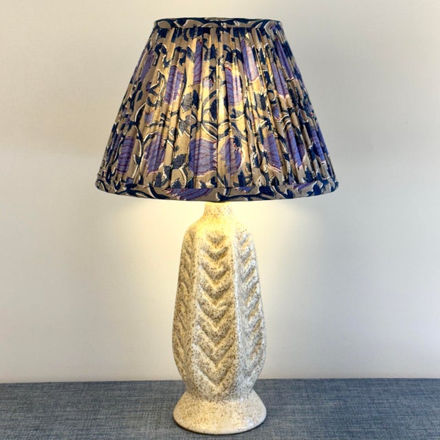 Speckled creamy MidCentury ceramic base with a gather pleated lampshade. Lamp base diameter 4” Height to top socket 12”...