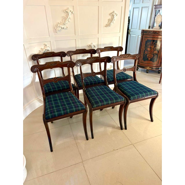 A fine and elegant set of six Regency dining chairs beautifully crafted in mahogany and richly carved throughout. The...