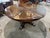 A striking blend of rustic character and refined craftsmanship, this Theodore Alexander expandable dining table makes a...