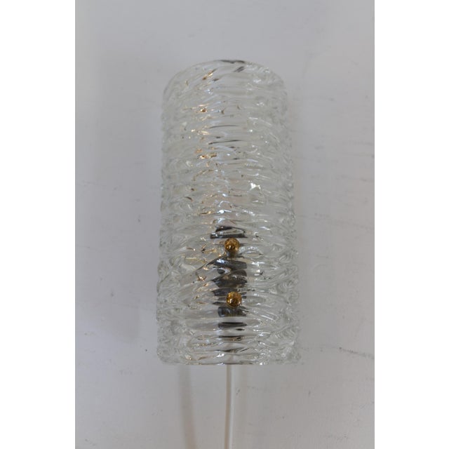 Swedish Mid-Century Glass and Brass Sconce, 1960s. Lovely Scandinavian Mid-Century Modern brass wall light with a clear...