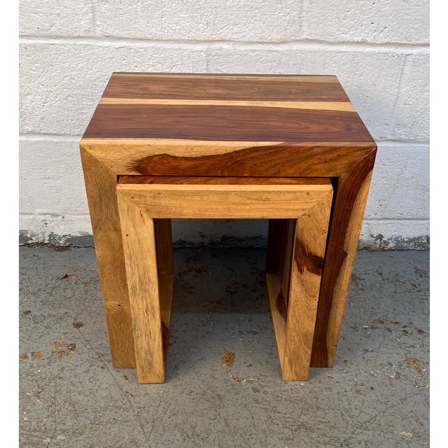 Bring natural warmth and modern simplicity to your space with this striking pair of solid Sheesham wood waterfall side...