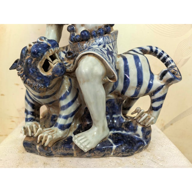 W-22cm,H-31cm This hand-carved blue and white porcelain statue depicts The Eighteen Arhats, a traditional Chinese Buddhist...
