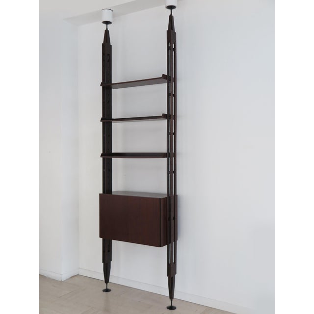 Single-span bookcase, model LB7, designed by Franco Albini for Poggi Pavia in 1956, shelves and cabinet in dark wood...