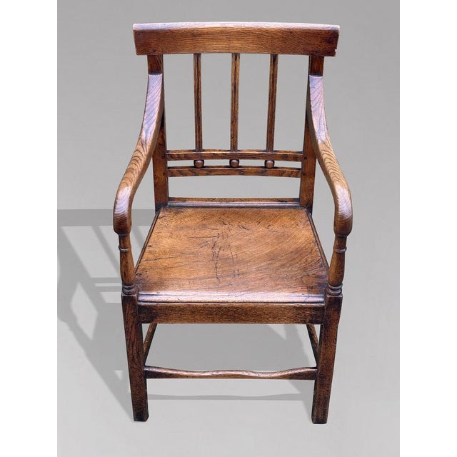 An Exceptional Late 18th-century Georgian Elm Country Carver Armchair, circa 1790 This handsome country chair is crafted...