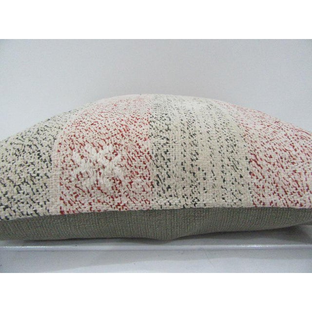 This is a pillow cover made from a vintage kilim rug. The piece was properly washed and ready to use. Pillow inserts not...