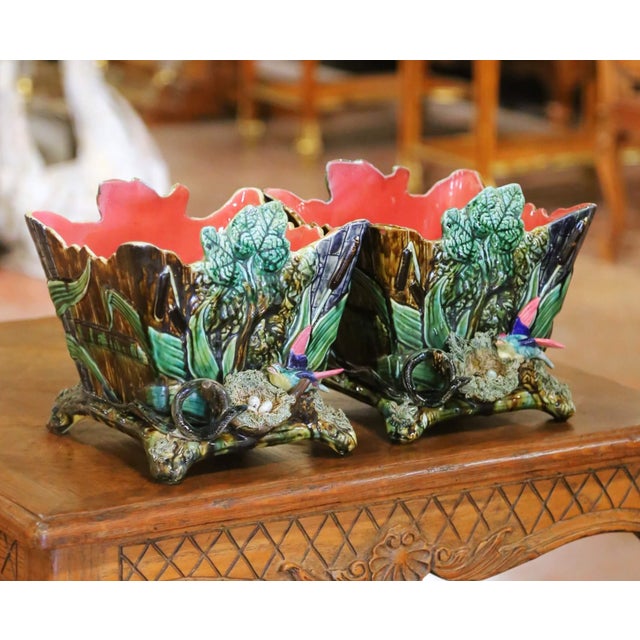 This colorful pair of antique Barbotine majolica jardinières brings the richness and whimsy of the natural world into an...
