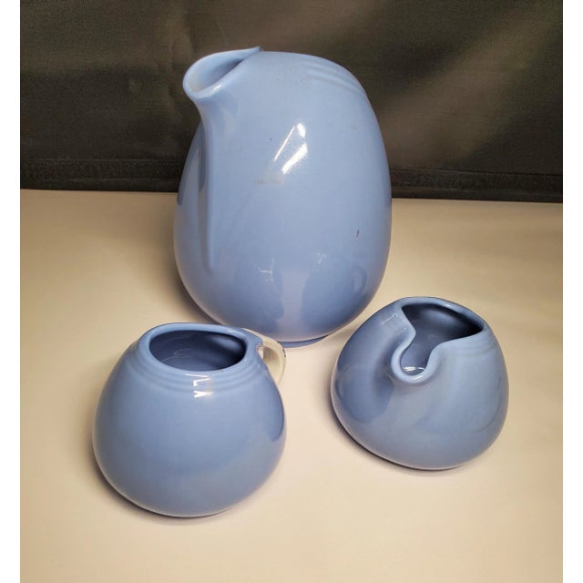 A wonderful 3 piece MCM set for your kitchen table. A wonderful shade of blue with a delicate floral accent on the...