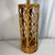 This vintage mid-century cylindrical table lamp features an open architectural lattice design crafted from hand-wrapped...