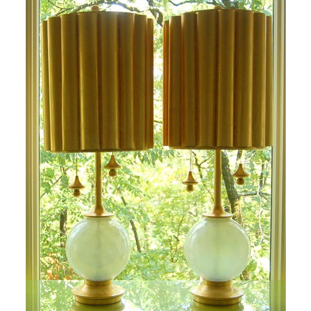 An awesome pair of vintage Venetian WHITE OPALINE glass table lamps by Marbro. The circular optics make the lamps look...