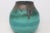 A beautifully proportioned studio pottery vase featuring a rich teal-green glaze with layered tonal depth and a dramatic...