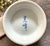 Beautiful vintage Japanese porcelain bud vase featuring a delicate hydrangea floral design in soft, muted shades of blue,...