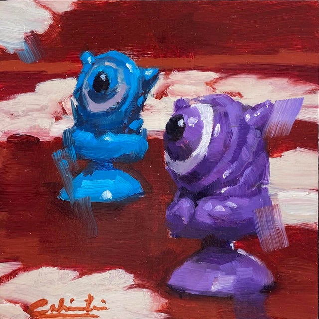 Little Aliens by Calvin Lai | Oil on canvas and wood panel Two colorful alien figurines on a red background For Sale