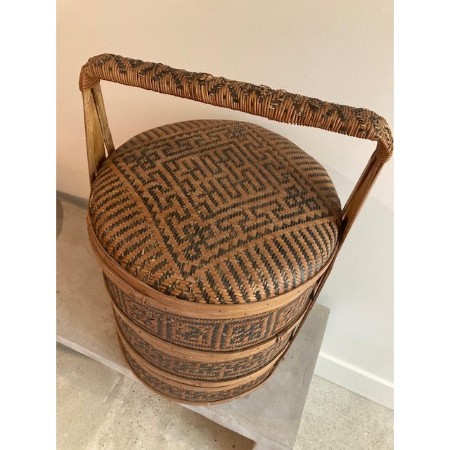 An early 20th century Chinese rattan, three tiered wedding basket. They were used forbringing gifts.