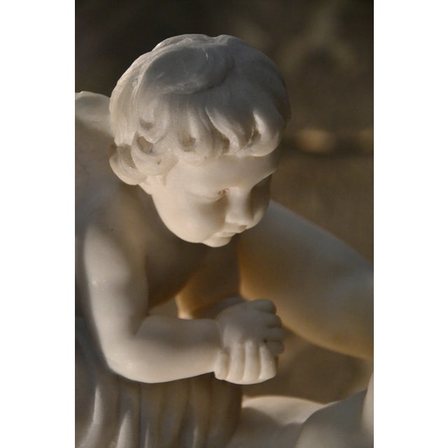 Carrare white marble sculpture according to Étienne Maurice Falconet representing Venus withdrawing a quiver from his Son...