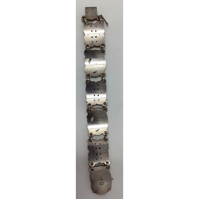 This Georg Jensen Jade and Sterling Silver Bracelet was designed in 1912 by Jensen and Pattern #14. The piece dates...