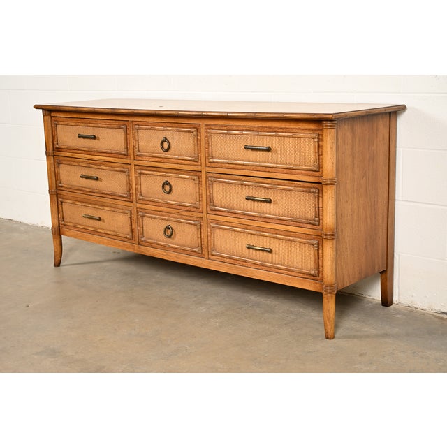 A gorgeous mid-century modern Hollywood Regency nine-drawer long dresser or credenza By Thomasville USA, Circa 1970s Pecan...