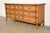 A gorgeous mid-century modern Hollywood Regency nine-drawer long dresser or credenza By Thomasville USA, Circa 1970s Pecan...