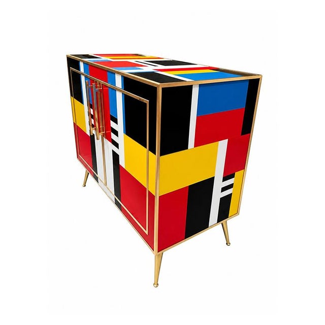 Two-door sideboard, entirely handcrafted, with a wooden structure covered in multicolored Murano glass. Brass gilded...
