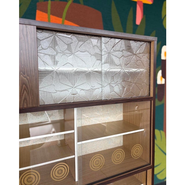 Super unique styling and size on this mid century tea hutch. Inspired by Japanese tea cabinets of the era, this features...