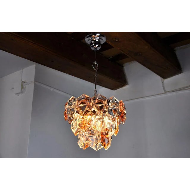 Rare two-colored Kinkeldey chandelier designated and produced in Germany in the 70s. Golden brass structure composed of...